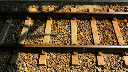metal railroads lines, rail and crushed stone. railway track. train track.