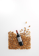 Top view of red wine bottle over wine corks