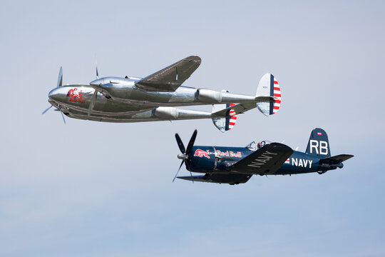 Zeltweg, Austria - September 3, 2022: AIRPOWER22 -  THE FLYING BULLS Chance-Vought F4U Corsair and LOCKHEED P-38 LIGHTNING