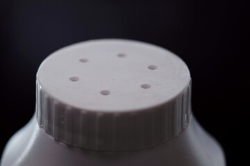 Close up of talcum bottle