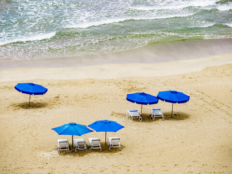 Umbrellas On Isla Verde  Beach On The Atlantic Ocean In The Metropolitan Area Of San Juan In Carolina Puerto Rico,