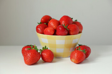 Fresh ripe juicy strawberries on white table