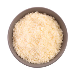 Delicious grated parmesan cheese in bowl isolated on white, top view