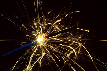 Fototapeta premium A sparkler is a firework that glows and sparks