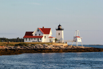 lighthouse on the shore of the sea