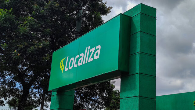 Locates (Localiza) The Largest Car Rental Company In Brazil. The Company's Logo Is White Letters On A Green Background. The Fleet Of Passenger Car