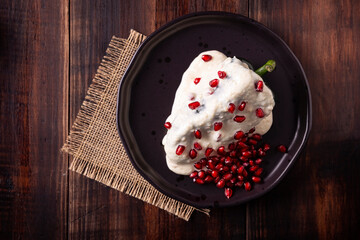 Chile en Nogada, Typical dish from Mexico. Prepared with poblano chili stuffed with meat and fruits and covered with a special walnut sauce. Named as the quintessential Mexican dish.