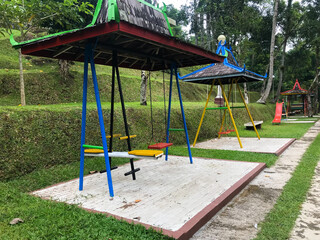 An Empty Swing with canopy in the park