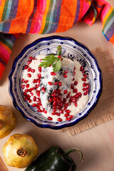 Chile en Nogada, Typical dish from Mexico. Prepared with poblano chili stuffed with meat and fruits...