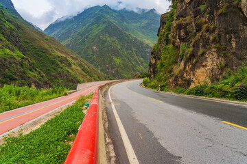 Beautiful scenery and asphalt roads in plateau mountains of Tibet Autonomous Region, China