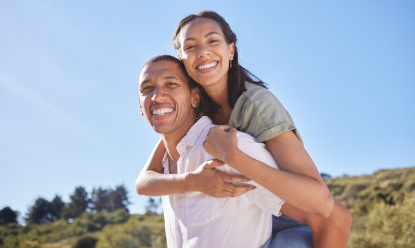 Love, Happy Couple And Travel Adventure With Young Lovers Out Hiking, Exploring And Traveling Through Nature In Summer. Portrait Smile Of Latino Man And Woman Enjoying Piggyback While Out For A Walk