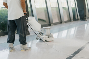 cleaning floor with machine	