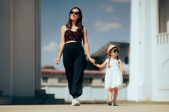 Cool Fashionable Mother And Daughter Walking Together Outdoors. Cool Glamours Mom And Child Relaxing Together Visiting New Places
