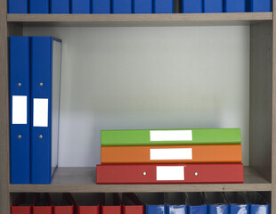 Document folder on shelf in office.