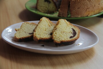 Sponge or sponge cake is a cake made from flour, sugar, and eggs. Sponge cakes and cakes are generally cooked by baking in the oven, although there are also steamed sponges