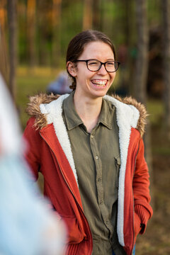 Smiling Young Adult Lady Laughing With Friends Outside On A Winter Afternoon