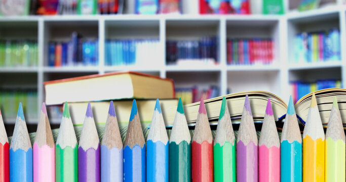 Image of pencils over book in school library