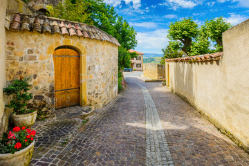 In the street of the medieval village Ternand in France