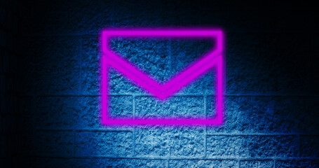 Fototapeta premium Image of glowing neon envelope icon on brick wall