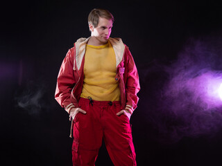 a young muscular man in a bright outfit poses in a pretentious pose, style and grotesque....
