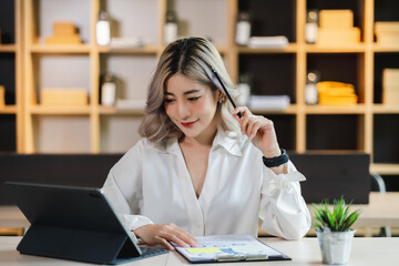 Asian beautiful businesswoman seriously working thinking idea for work on computer and think...