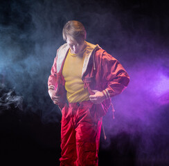 a young muscular man in a bright outfit poses in a pretentious pose, style and grotesque....