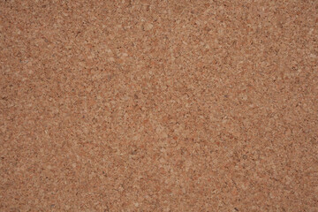Cork board background is used for design work.
