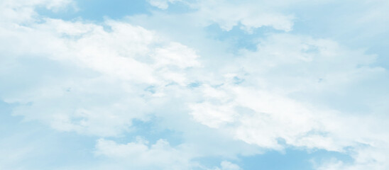 Abstract fantastic and realistic blue sky background, blurry and puffy cloudscape morning sky of the winter season, blue watercolor shades clouds of blue natural sky with clouds.