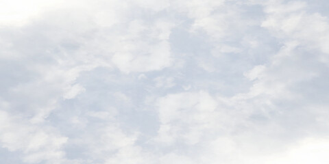 White clouds on painted puffy blue sky, winter seasonal blue sky background with blurry clouds, realistic morning sky surrounding with clouds cape.