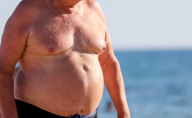 Naklejka premium Fat man by the sea.