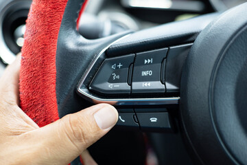 Push-buttons mounted on the steering wheel to turn the audio on and off, answer the phone, driving options for convenience and technology today.