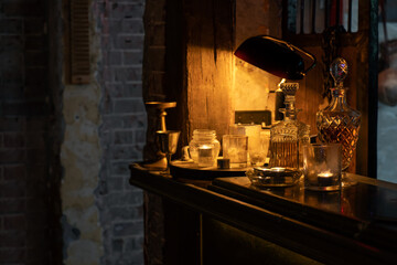 Set of Alcohol bottles decorates on bar counter as Concept of Divine magic and occultism.