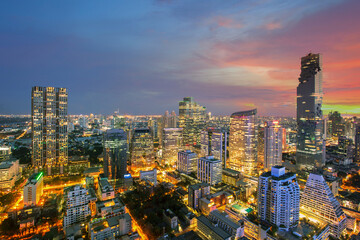Fototapeta premium Bangkok Cityscape, Modern High building in Business district at dusk. Day to night of Bangkok city concept. (Thailand)