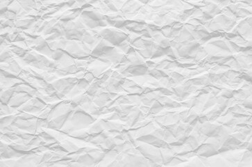 Creative background with scattered overlay of crumpled white paper.	