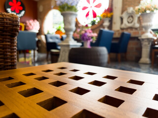 The empty coffee table over defocused coffee shop background.