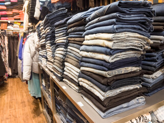 Jeans and Fashion Clothes in clothing store, at Thailand.