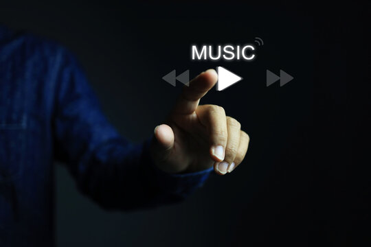 Hand reachout to touch to activate the plat button. Music on or play concept.