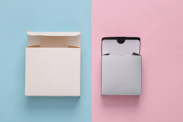 White and metallic color empty boxes mock up on blue pink background