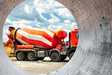 Concrete mixer truck in front of a concrete batching plant, cement factory. Loading concrete mixer...