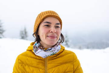 a woman on the background of snow-capped mountains