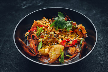 Pasta with seafood herbs sesame seeds and nuts