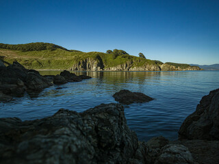 Rocky shore of Japanese sea in summer.