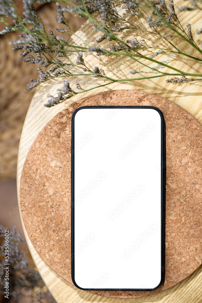 Aufkleber mockup blank screen mobile on round table with sunlight