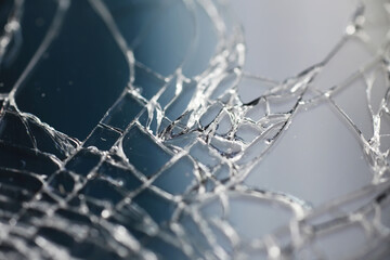 Crack on the glass. Broken screen. Broken phone. Cracked glass background. White cracks in the glass.