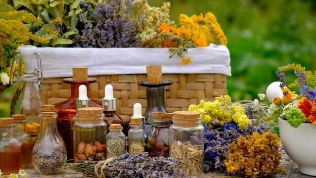 Medicinal herbs and tinctures on the table. Selective focus.