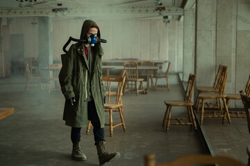 Environmental disaster. Post apocalyptic survivor in gas mask. Doomsday clothing. Nature protection