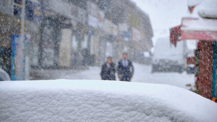two businessmen walking in the snow