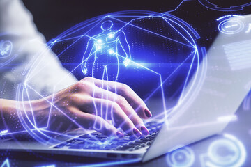 Double exposure of woman hands typing on computer and general theme hologram drawing. Education concept.