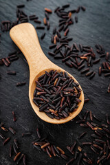 Black rice, also known as purple rice or forbidden rice. Organic unpolished black rice grains as a source of complex carbohydrates and high in antioxidants.  