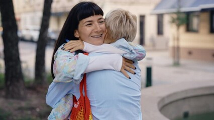 Lesbian couple are delighted after their pregnancy test results, feeling happy about the results.Hugging and smiling each other with love. Family, woman love and romantic relationship concept - Powered by Adobe